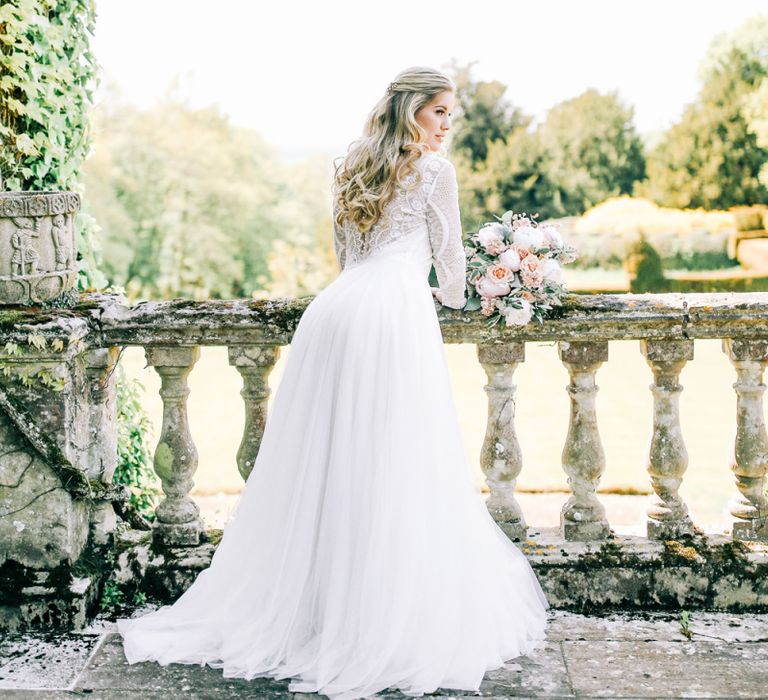 Bride in Lace Wedding Dress Holding White Peony and Peach David Austin Rose Wedding Bouquet