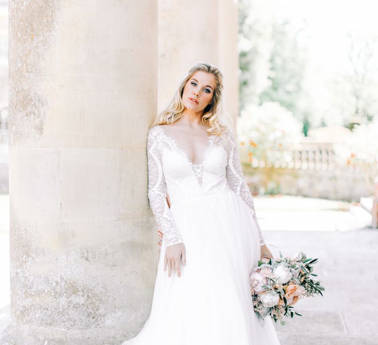 Bride in Romantic Lace Long Sleeve Wedding Dress Holding Peach &amp; White Wedding Bouquet