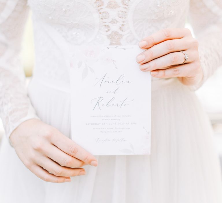 Bride Holding Elegant Wedding Invitation