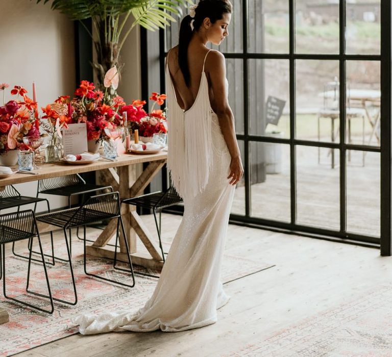 Bride in Low Back Wedding Dress with Fringe Detail