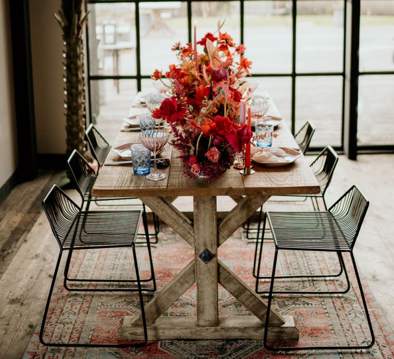 Modern Pink and Red Table Flowers in Front of a Floor to Ceiling Window