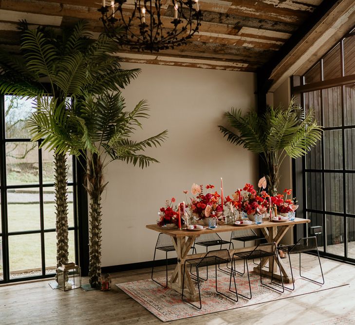 Intimate Wedding Reception Table with Red and Pink Flowers