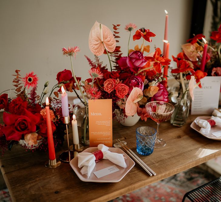 Modern Tablescape with Pink and Red Floral Centrepieces, Taper Candles, and On the Day Stationery