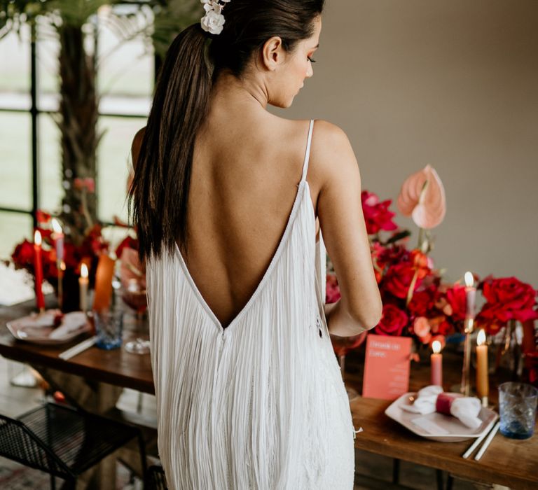 Bride in Low Fringe Back Wedding Dress with Sleek Pony Tail