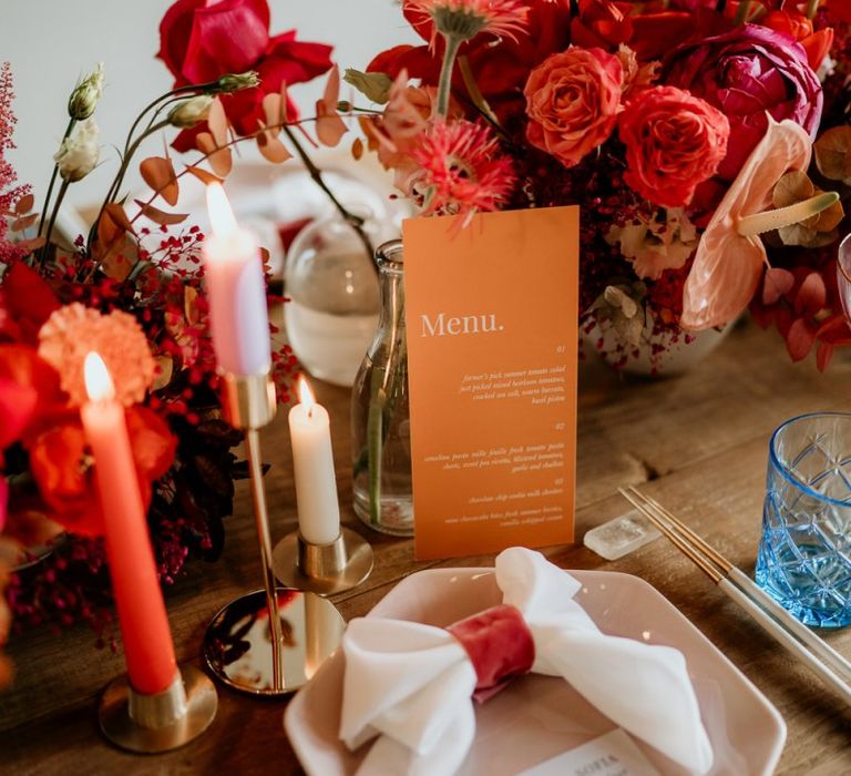 Place Setting with Red and Pink Wedding Flowers and Details