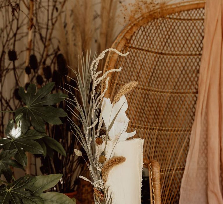 Tall Minimalist Wedding Cake Decorated with Dried Flowers and Grasses