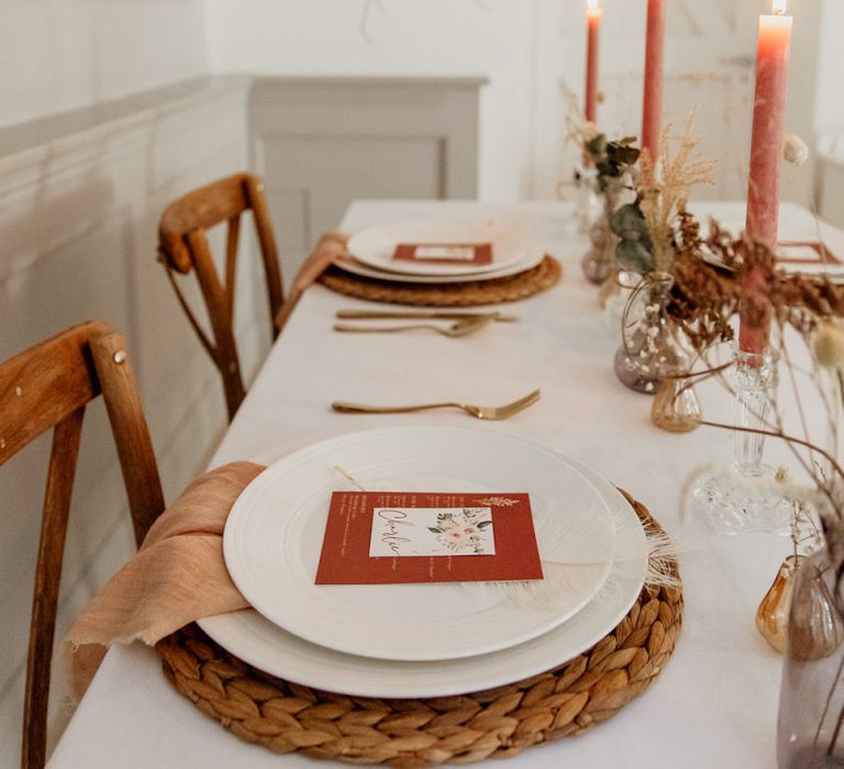 Place Setting with Wicker Place Mat, Gold Cutlery and Menu Card