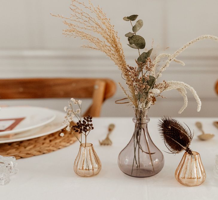 Small Votives with Flower Stems and Dried Grasses