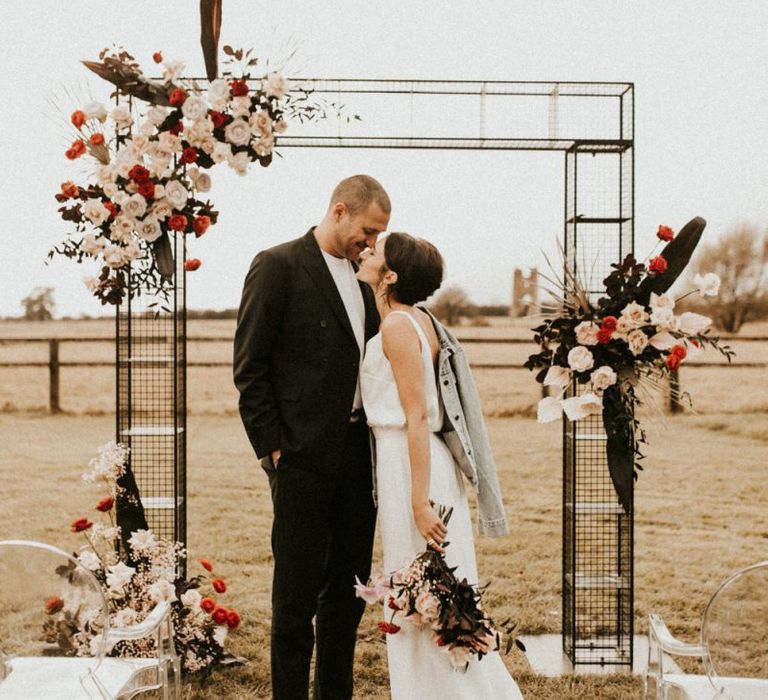 Metal frame decorated in pink and red flowers