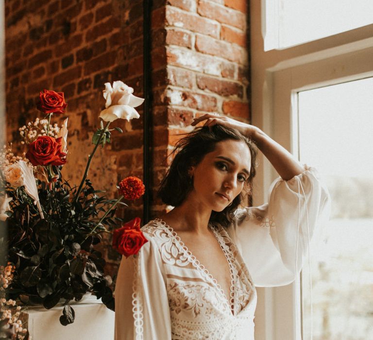 Boho wedding dress with lace detail and long bell sleeves