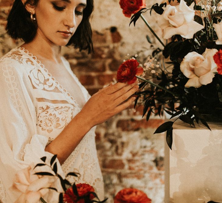 Boho bride in lace wedding dress at Godwick Great Barn