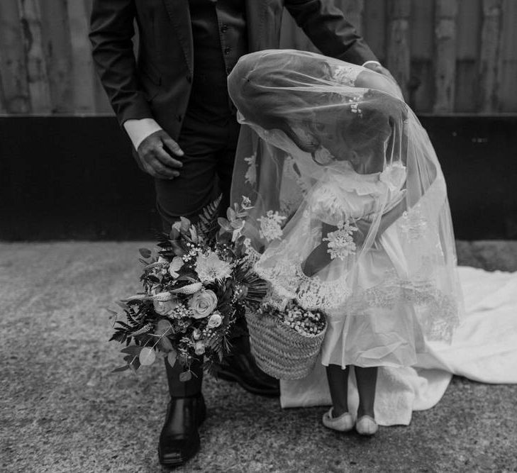 Bride wears dress by Pronovias. Groom wears green velvet blazer from Gieves &amp; Hawkes in this Green And White Luxe, City Wedding. Photography by The Curries.