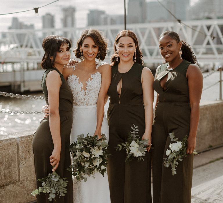 Bridal Party. Bride wears dress by Pronovias. Groom wears green velvet blazer from Gieves &amp; Hawkes in this Green And White Luxe, City Wedding. Photography by The Curries.