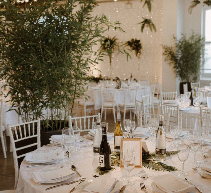 Table decor. Geometric terrariums and Minimalist decor for this Green And White Luxe, City Wedding. Photography by The Curries.