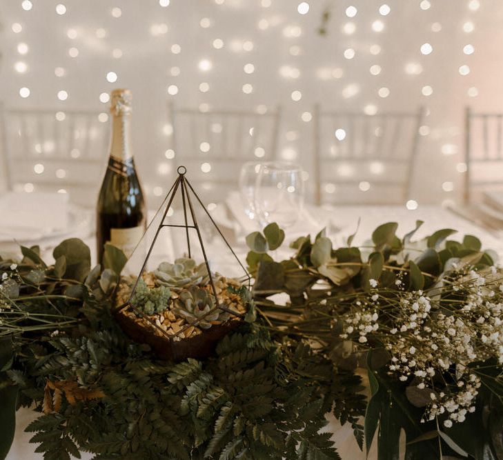 Table decor. Geometric terrariums and Minimalist decor for this Green And White Luxe, City Wedding. Photography by The Curries.