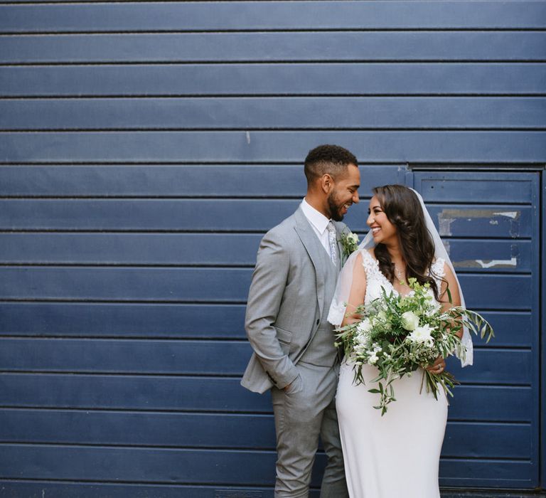 Green Foliage and White Roses. Bride Wears Wed2b Dress. Modern Warehouse Wedding in London at Trinity Buoy Wharf. Images by Captured by Katrina Photography