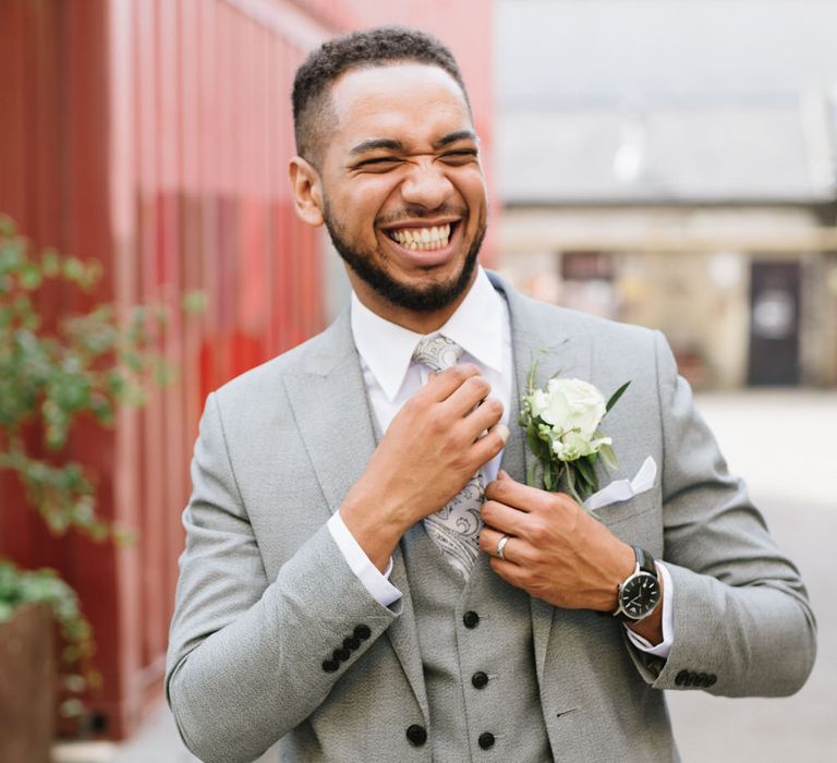 Groom Wears Grey Moss Bros Suit. Modern Warehouse Wedding in London at Trinity Buoy Wharf. Images by Captured by Katrina Photography