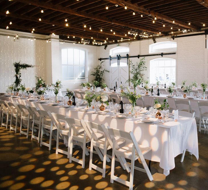 Green Foliage with White Roses and Copper Accents. Modern Warehouse Wedding in London at Trinity Buoy Wharf. Images by Captured by Katrina Photography