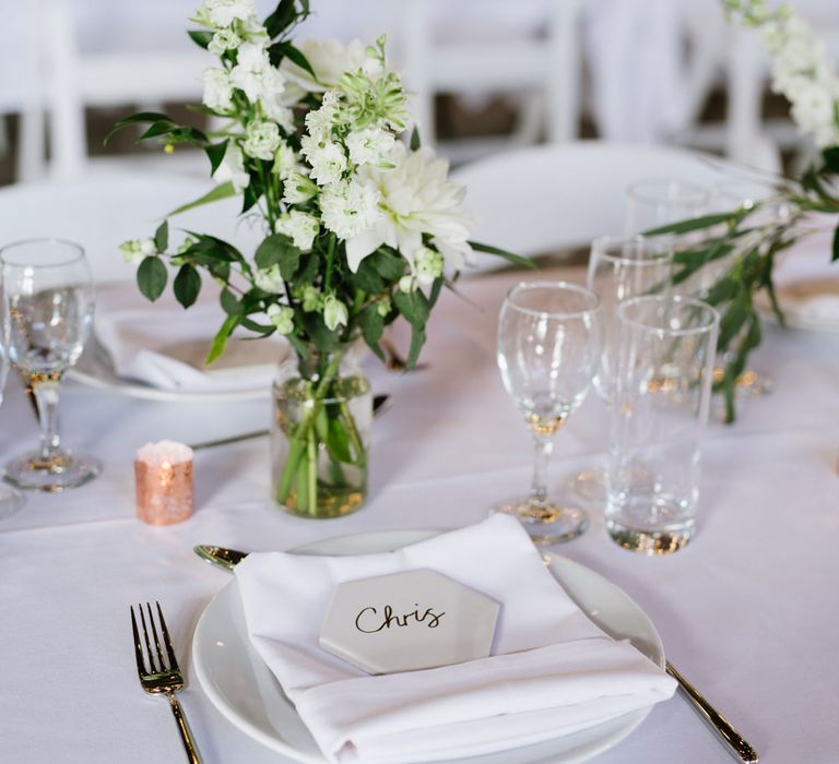 DIY Tile Name Place Settings. Green Foliage with White Roses and Copper Accents. Modern Warehouse Wedding in London at Trinity Buoy Wharf. Images by Captured by Katrina Photography