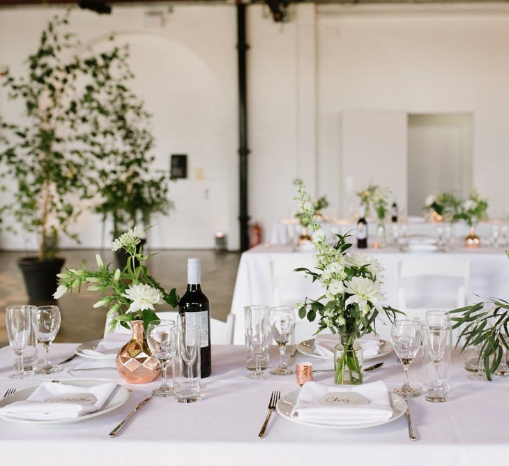 Green Foliage with White Roses and Copper Accents. Modern Warehouse Wedding in London at Trinity Buoy Wharf. Images by Captured by Katrina Photography