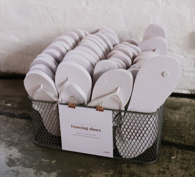 Flip flops for Guests. Modern Warehouse Wedding in London at Trinity Buoy Wharf. Images by Captured by Katrina Photography