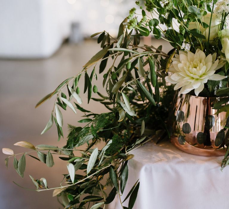 Green Foliage with White Roses and Copper Accents. Modern Warehouse Wedding in London at Trinity Buoy Wharf. Images by Captured by Katrina Photography