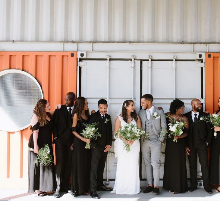 Monochrome Bridal Party Fashion. Bridesmaids in Boohoo Black Dresses. Modern Warehouse Wedding in London at Trinity Buoy Wharf. Images by Captured by Katrina Photography