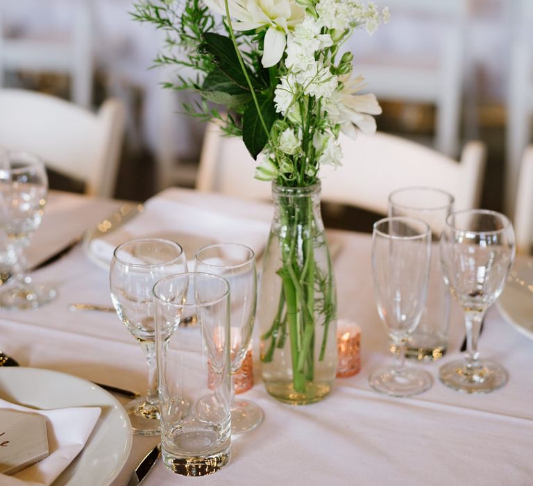 Green Foliage with White Roses and Copper Accents. Modern Warehouse Wedding in London at Trinity Buoy Wharf. Images by Captured by Katrina Photography