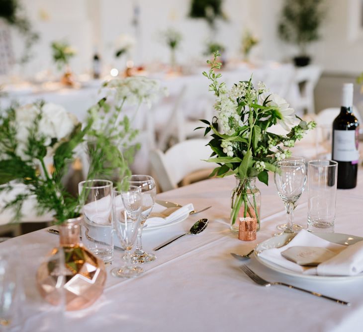 Green Foliage with White Roses and Copper Accents. Modern Warehouse Wedding in London at Trinity Buoy Wharf. Images by Captured by Katrina Photography