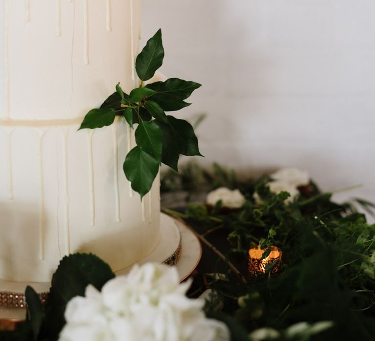 Simple Salted Caramel and White Chocolate Wedding Cake. Green Foliage with White Roses and Copper Accents. Modern Warehouse Wedding in London at Trinity Buoy Wharf. Images by Captured by Katrina Photography