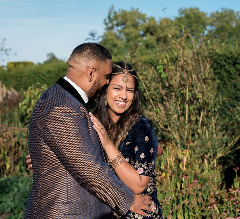 Bride and groom-to-be in traditional Indian engagement outfits