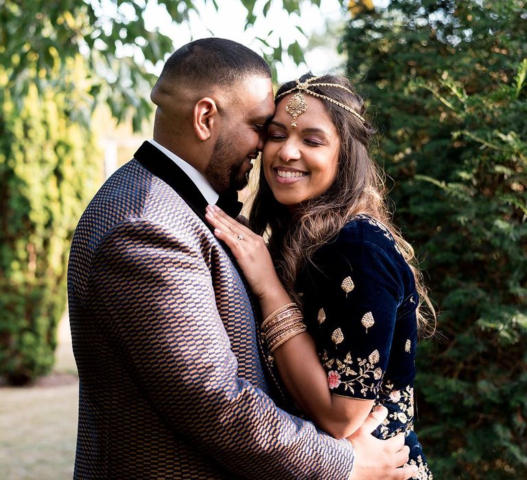 Groom-to-be embracing his bride-to-be at Engagement shoo