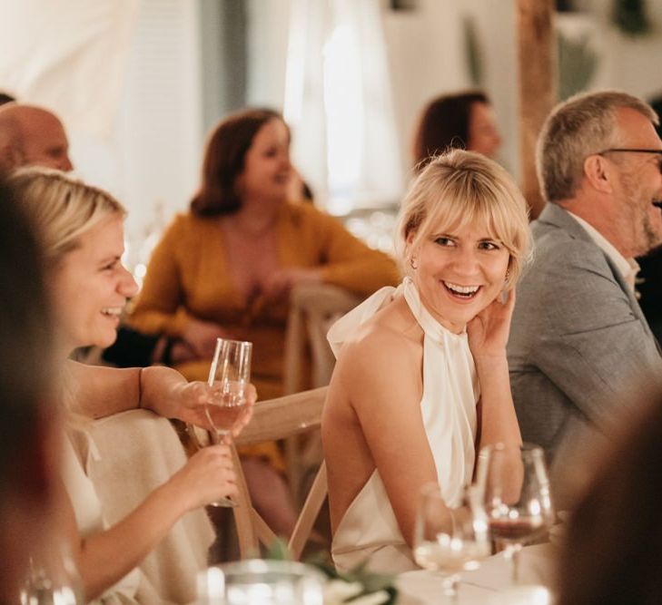 Bride enjoys wedding speeches