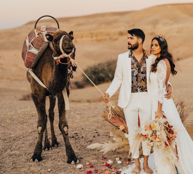 Moroccan wedding in the desert with stylish bride and groom