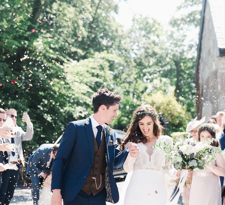 Groom In Navy Suit With Maroon Waistcoat From Moss Bros. // Image By Emma Pilkington