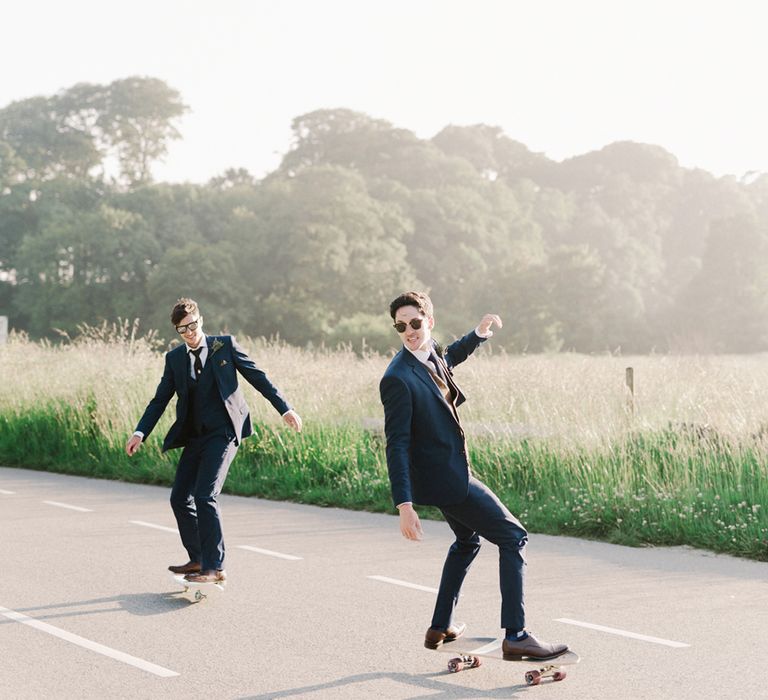 Groom In Navy Suit With Maroon Waistcoat From Moss Bros. // Image By Emma Pilkington