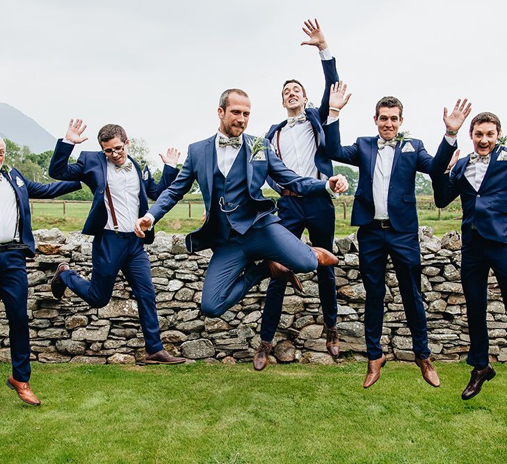 Groom In Blue Suit With Floral Bow Tie From Moss Bros. // Image By Sarah Beth Photo