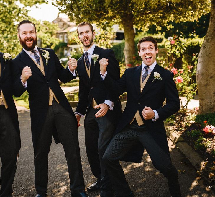 Groomsmen In Tails With Mustard Yellow Waistcoats From Moss Bros. // Image By Andy Gaines Photography