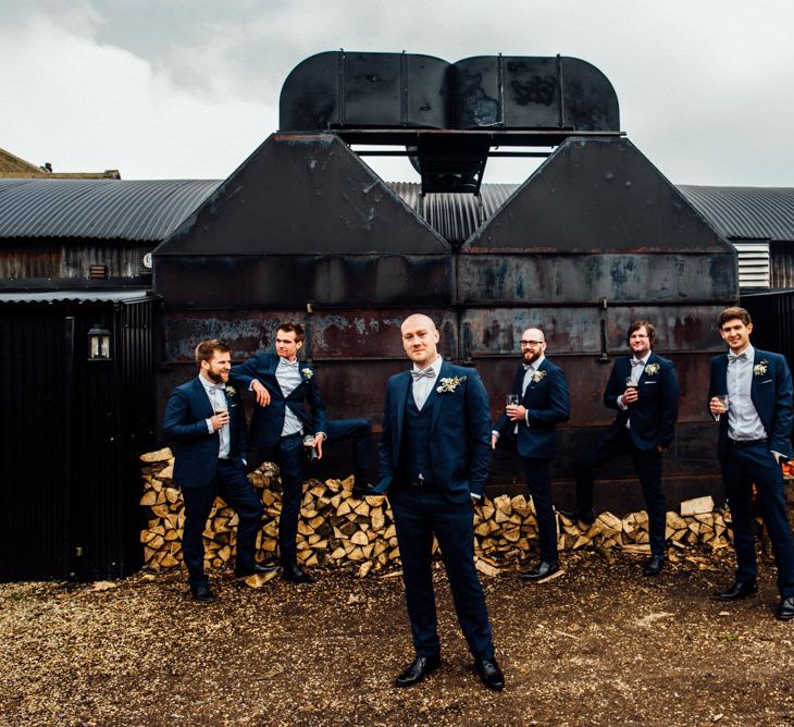 Groom &amp; Groomsmen In Navy Suits From Moss Bros. // Image By Michelle Wood Photography