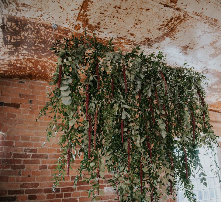 Hanging Greenery Installation | Copper &amp; Greenery Industrial Winter Wedding at The West Mill Derby, Styled by The Vintage House That Could | Rosie Kelly Photography | Jason Lynch Weddings