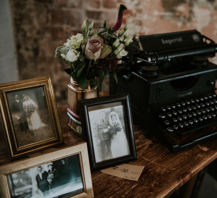 Vintage Typewriter &amp; Family Portraits Wedding Decor | Copper &amp; Greenery Industrial Winter Wedding at The West Mill Derby, Styled by The Vintage House That Could | Rosie Kelly Photography | Jason Lynch Weddings