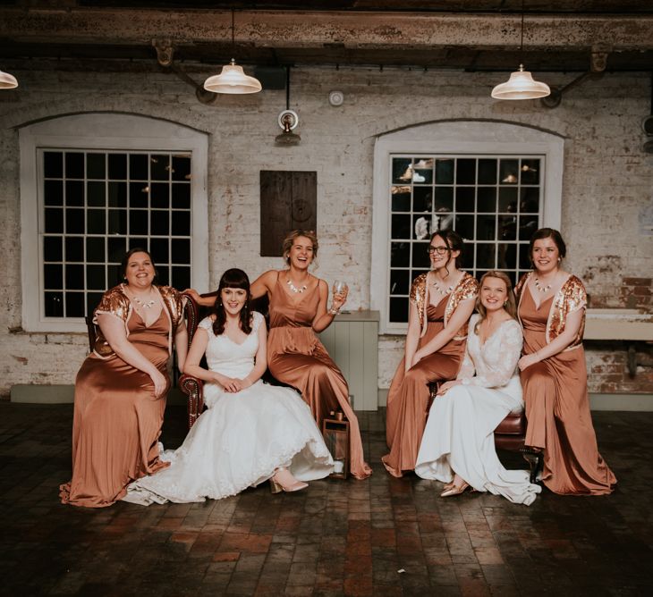 Bridal Party | Bronze ASOS Bridesmaid Dresses | Brides in WED2B Bridal Gowns | Copper &amp; Greenery Industrial Winter Wedding at The West Mill Derby, Styled by The Vintage House That Could | Rosie Kelly Photography | Jason Lynch Weddings