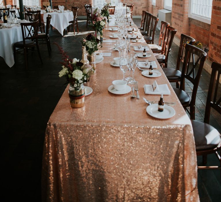 Sequin Table Cloth Top Table Wedding Decor | Copper &amp; Greenery Industrial Winter Wedding at The West Mill Derby, Styled by The Vintage House That Could | Rosie Kelly Photography | Jason Lynch Weddings