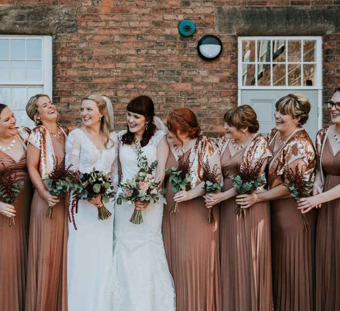 Bridal Party | Bronze ASOS Bridesmaid Dresses | Brides in WED2B Bridal Gowns | Copper &amp; Greenery Industrial Winter Wedding at The West Mill Derby, Styled by The Vintage House That Could | Rosie Kelly Photography | Jason Lynch Weddings