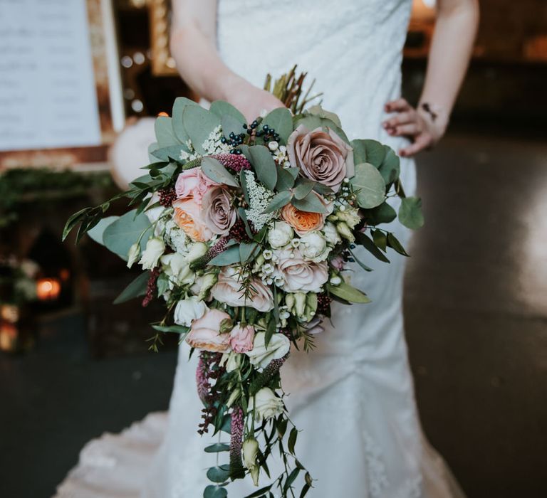 Trailing Winter Bridal Bouquet | Bride in Lace WED2B Bridal Gown | Copper &amp; Greenery Industrial Winter Wedding at The West Mill Derby, Styled by The Vintage House That Could | Rosie Kelly Photography | Jason Lynch Weddings