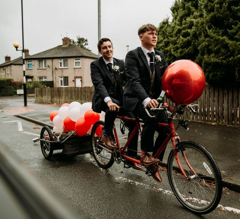 Groom arrives on tandem bike