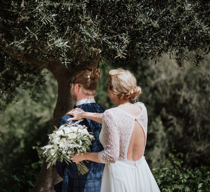 First Look with Bride in Keyhole Lace Back Rembo Styling Wedding Dress Approaching Her Groom