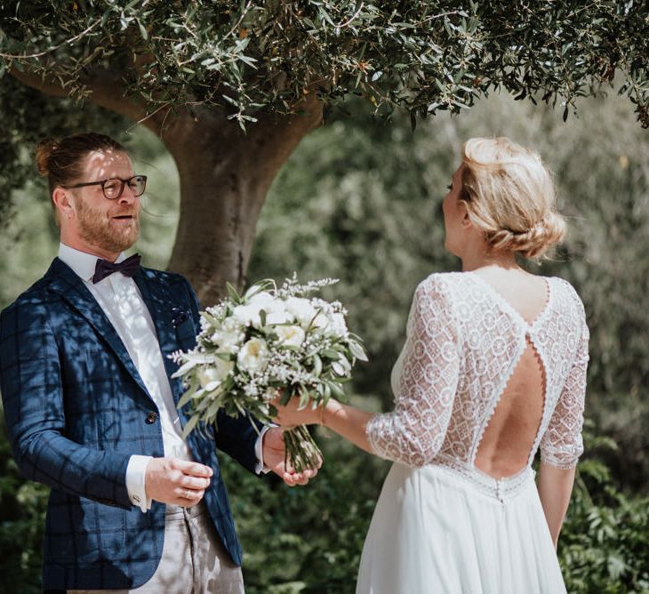 First Look with Groom Seeing His Bride in a Lace Back Rembo Styling Wedding Dress