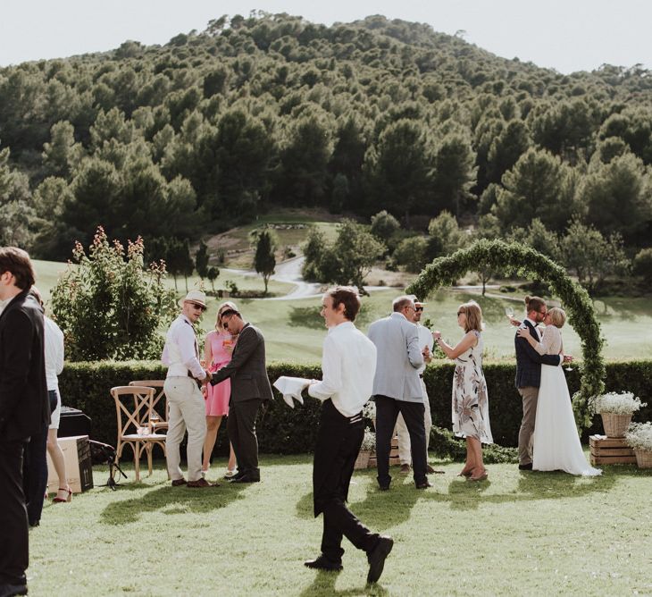 Wedding Guests Enjoying the Outdoor Reception