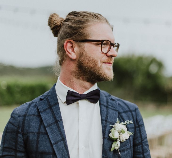 Stylish Groom in Navy Check Blazer, Bow Tie, Top Knot &amp; Glasses